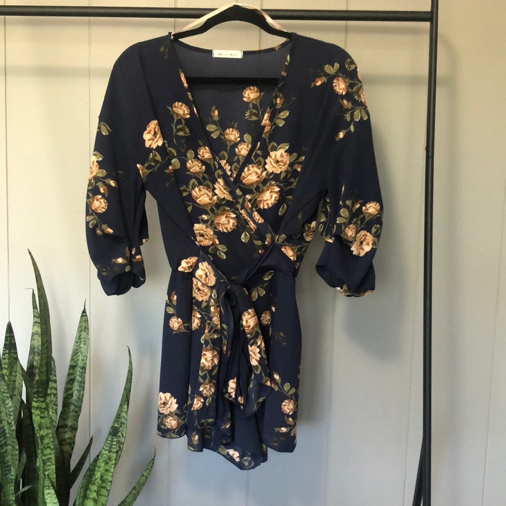 NAVY BLUE FLORAL HALF SLEEVE FRONT TIE ROMPER